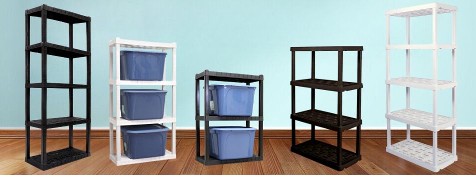Three black and two white Oskar storage shelves on a wood floor in front of an aqua wall