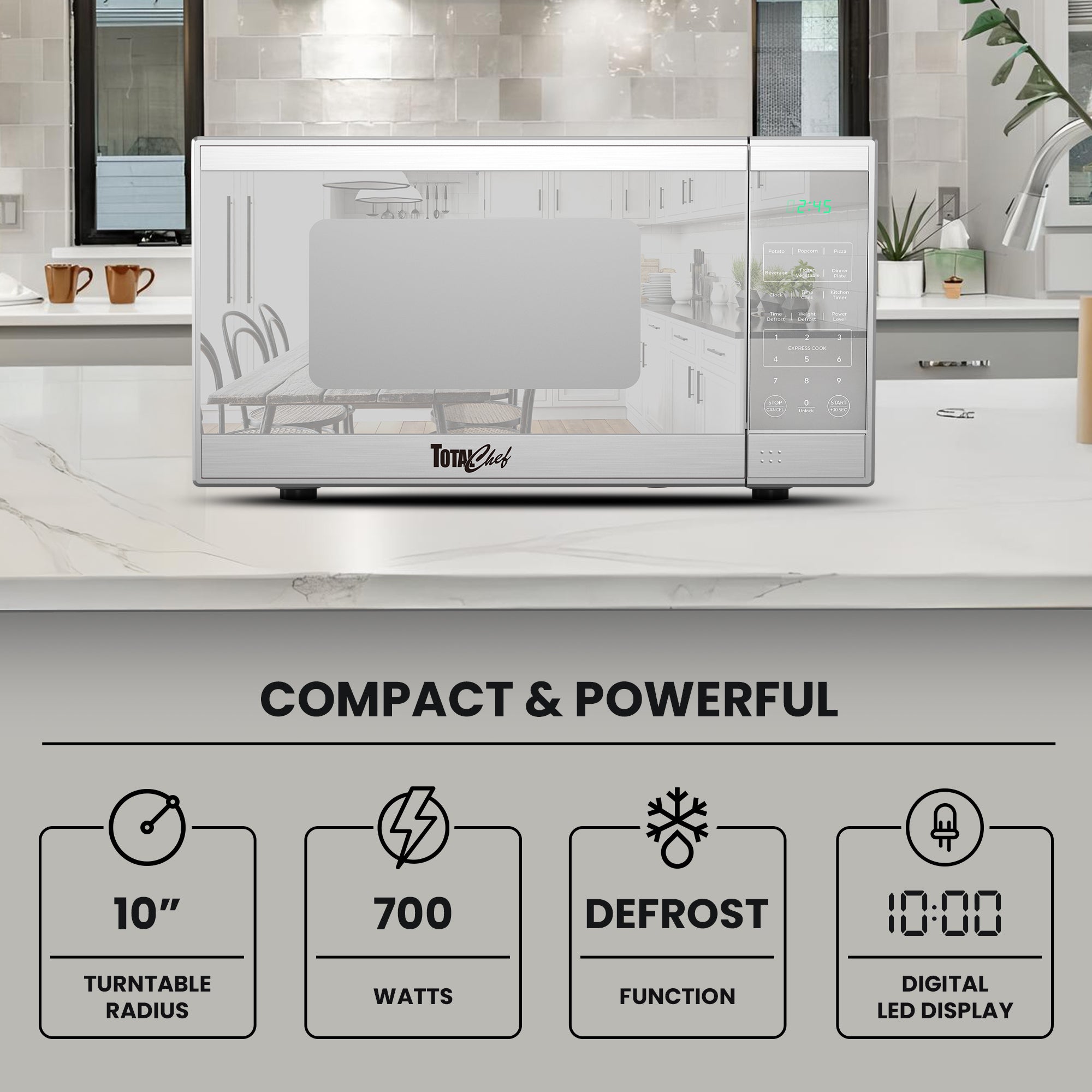 Total Chef stainless steel microwave, closed, on a gray kitchen counter with text and icons below describing features: Compact and powerful; 10" turntable radius; 700 watts; defrost function; digital LED display