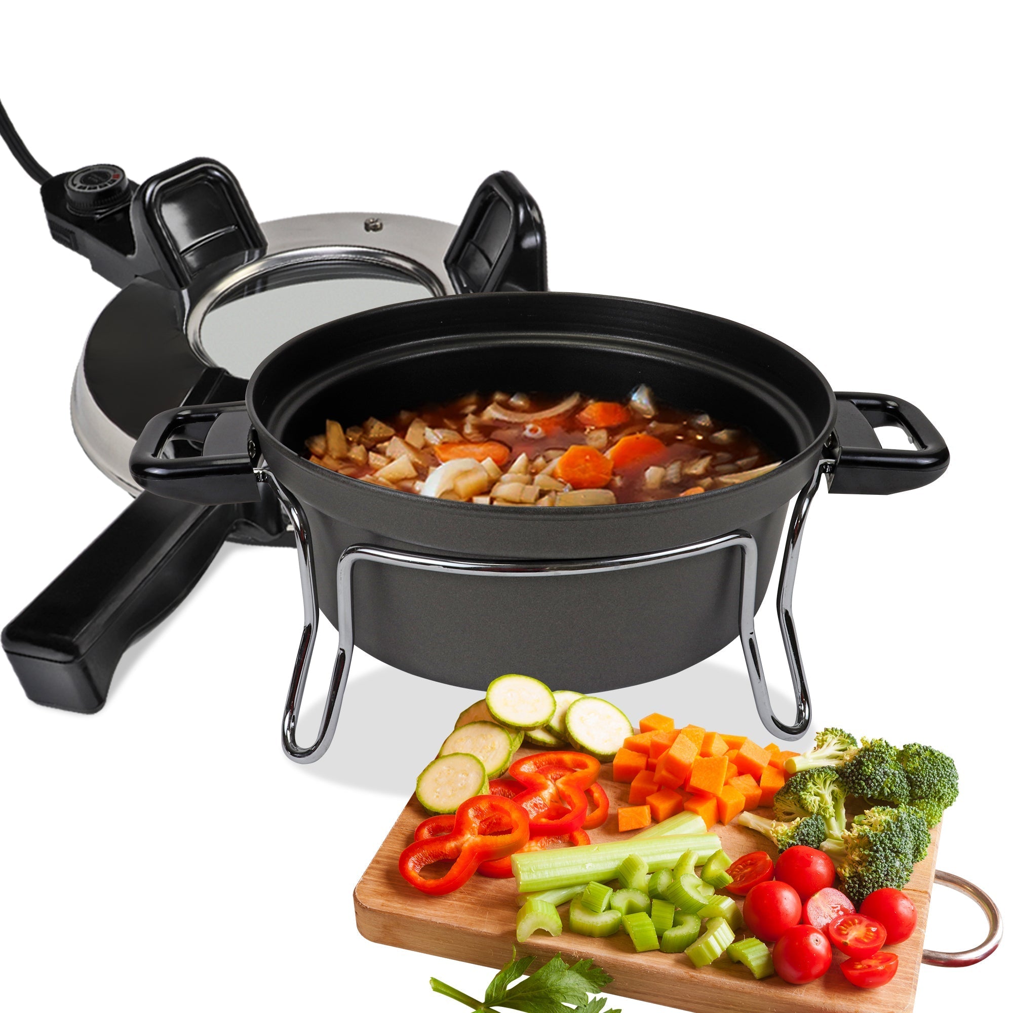 Product shot of Czech cooker electric oven on a white background. The cooking pot is on its stand and filled with stew, the lid is behind it, and a cutting board with assorted chopped vegetables is in front