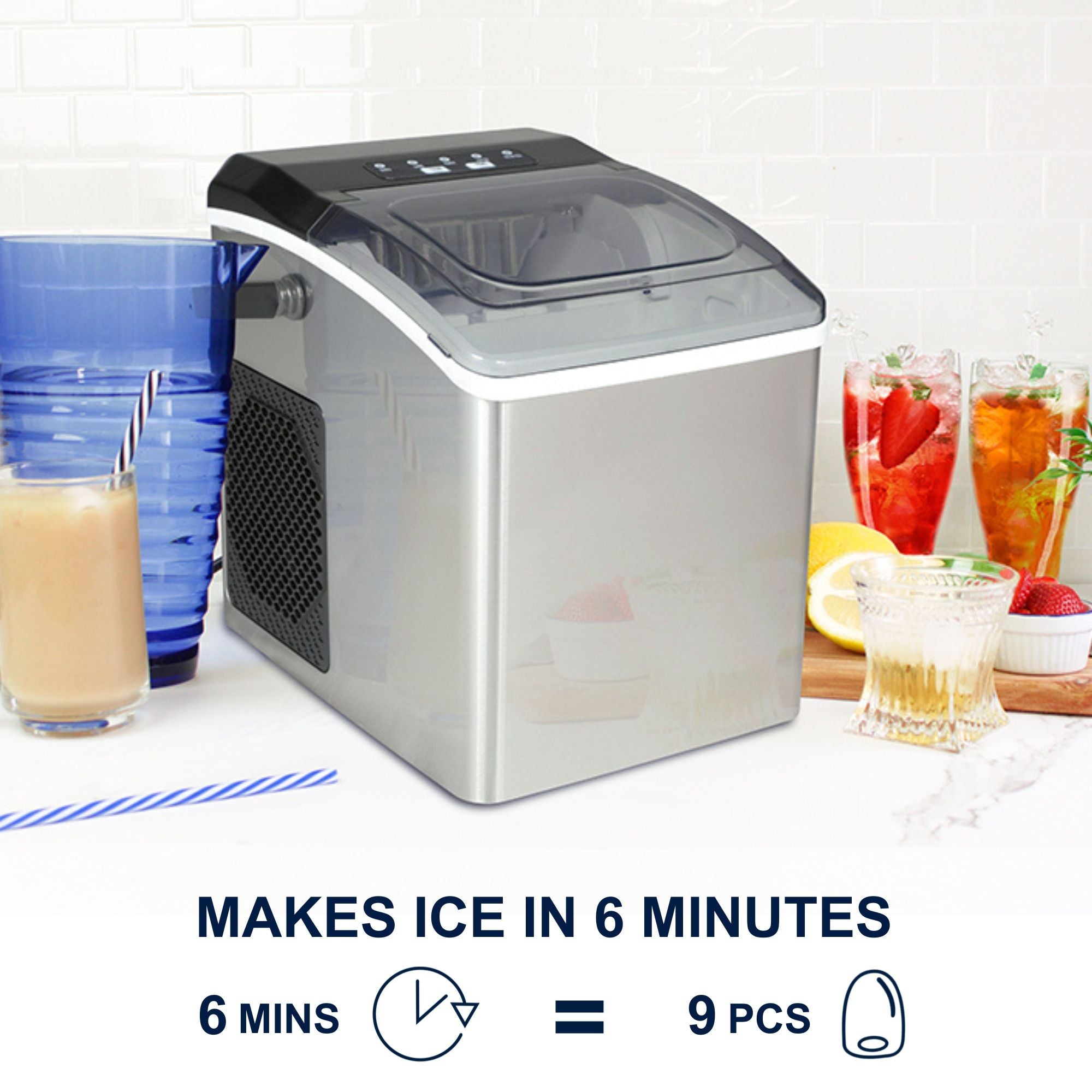 Stainless steel ice maker on a white countertop with a blue pitcher, iced coffee, and sliced lemon beside it. Text and icons below read, "Makes ice in 6 minutes; 6 mins = 9 pcs"