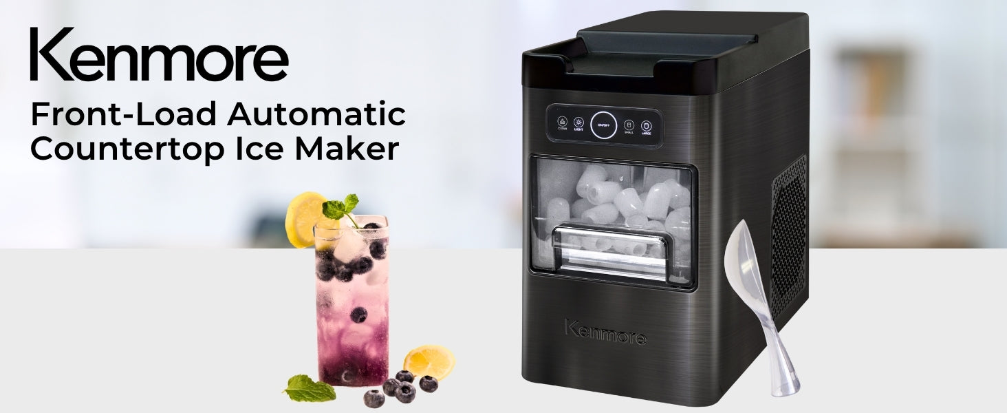 Kenmore front-load ice maker on a white counter with a glass of sparkling water and berries