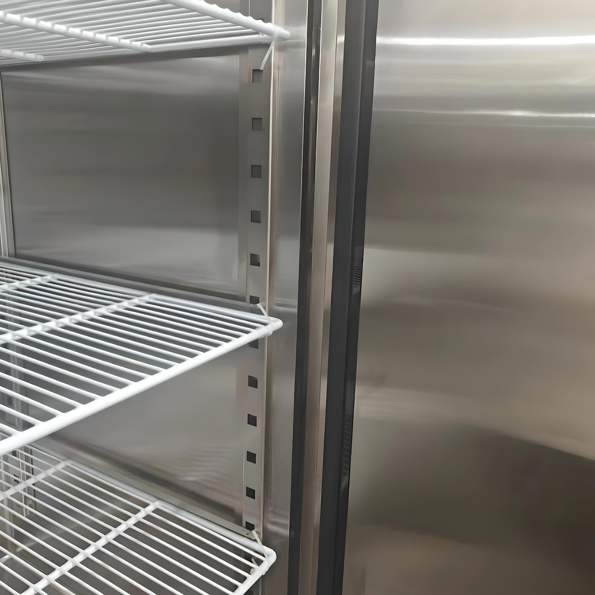 Closeup of the removable shelves inside the Kenmore Pro 72 cu ft commercial reach-in solid door stainless steel convertible freezer/refrigerator